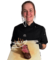 Chef with plated steak dish
