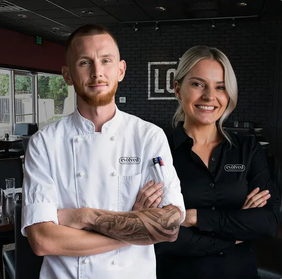 A professional caterer in Fallston, MD, arranging a fresh food display for a local event.