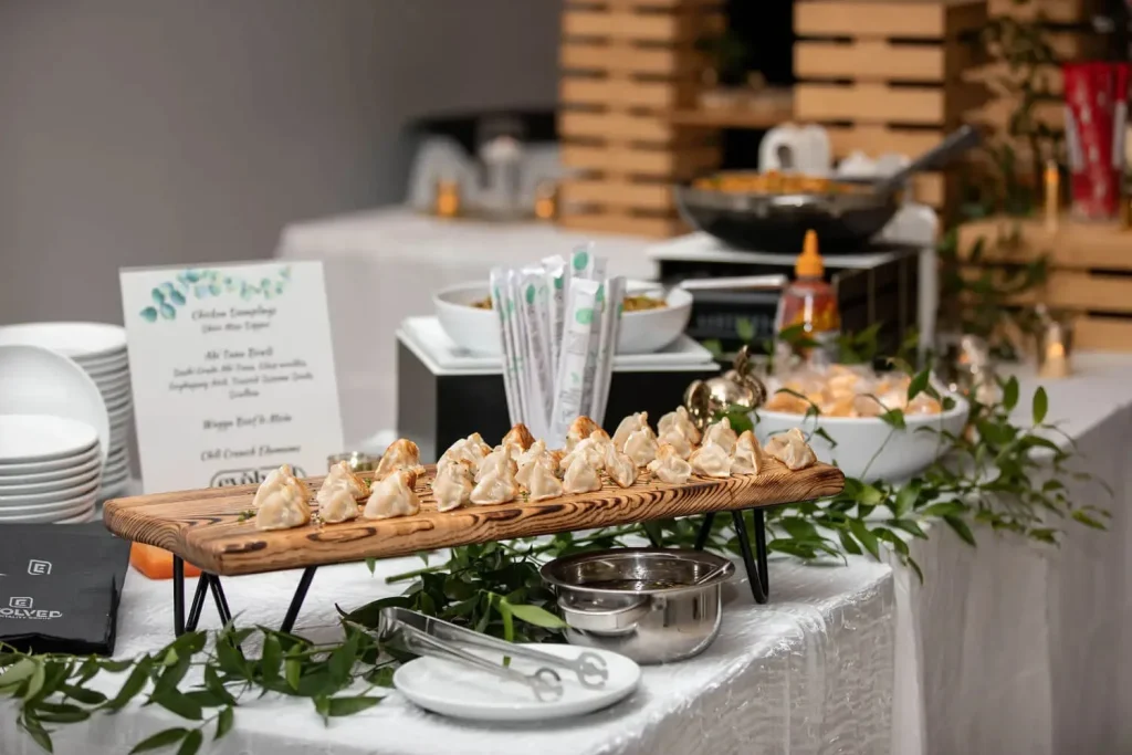 A professional caterer in Fallston, MD, arranging a fresh food display for a local event.