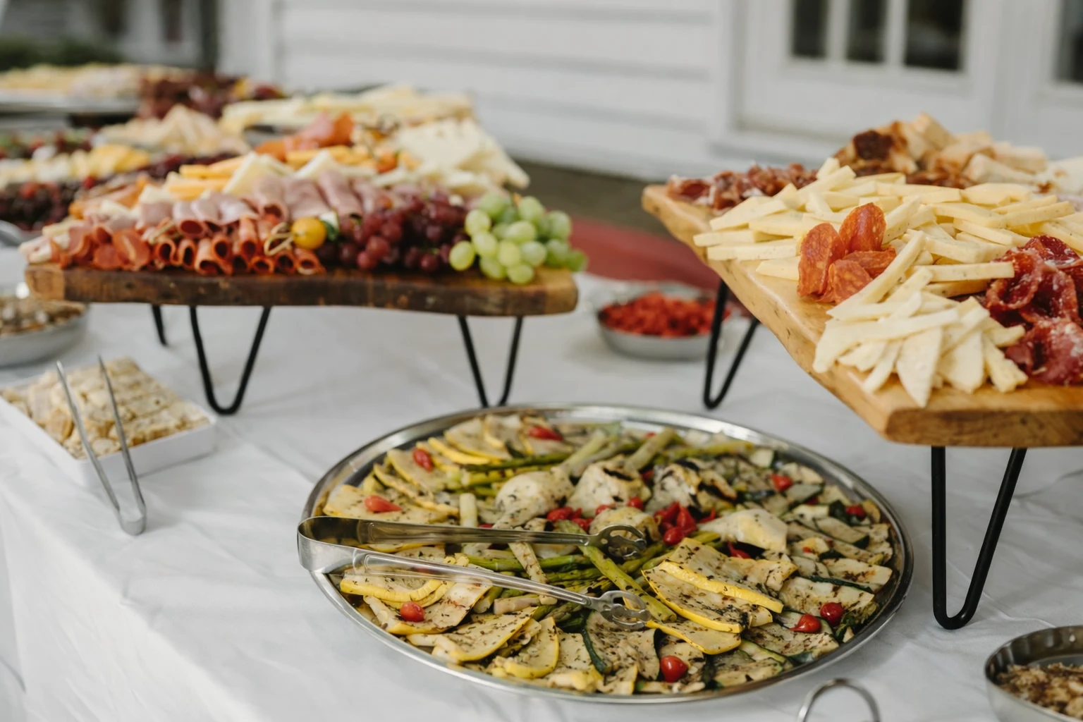 Guests gathered around a long dining table enjoying a cozy family style catering experience in a Baltimore, MD home