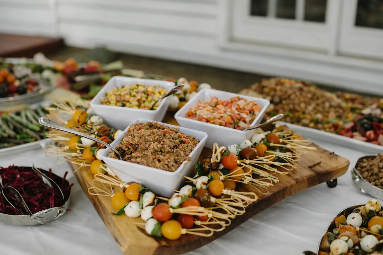 Elegant antipasto platter with caprese skewers and gourmet spreads prepared for plated dinner catering in Baltimore, MD