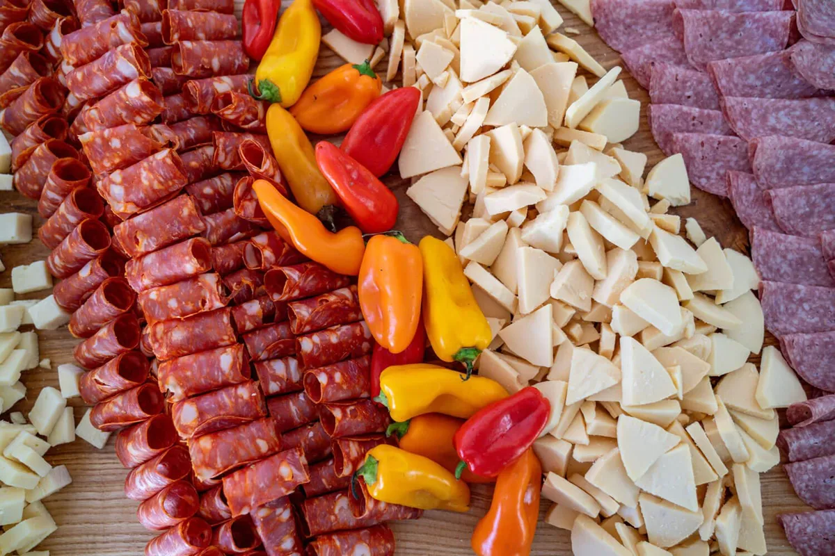 Charcuterie and antipasto spread with cured meats, cheeses, and peppers for a Baltimore buffet catering event