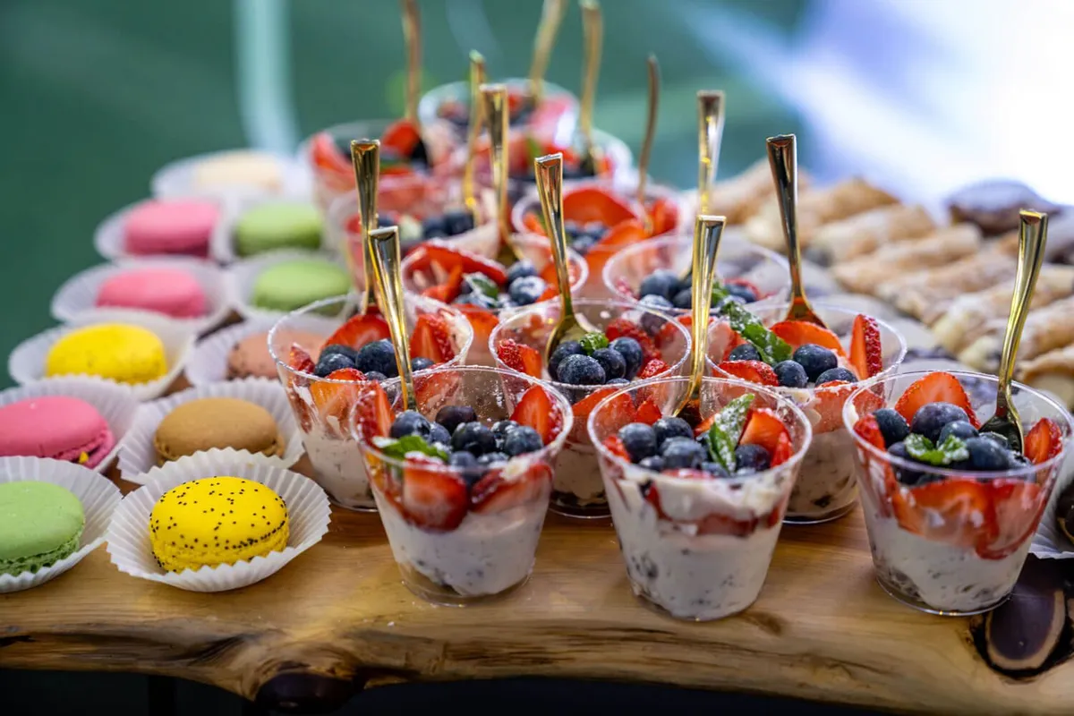 Fresh berry dessert cups and macarons from Evolved Catering Baltimore