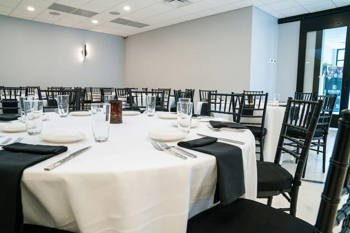 Banquet hall with round tables set for a full-service catering event in Baltimore